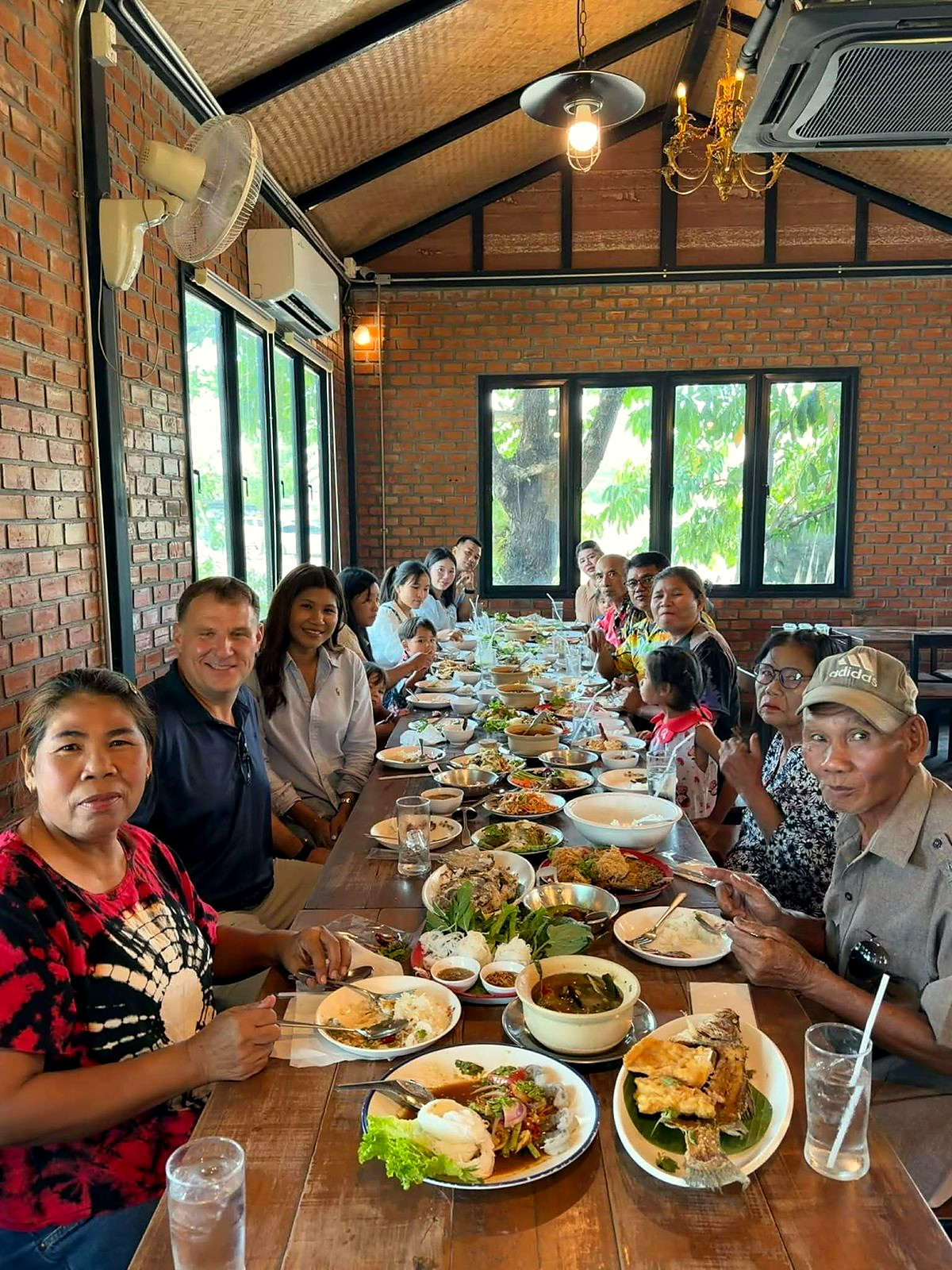 A long table in Surin, Ploy's extended family sharing a meal together