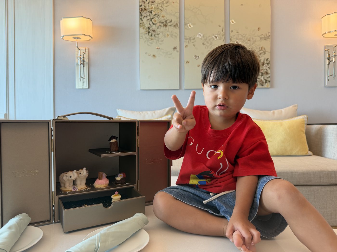 Lincoln sitting beside the dessert cabinet in the hotel suite